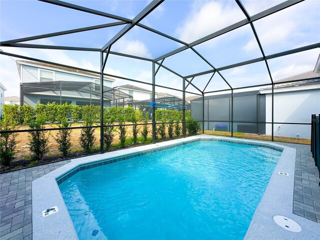 view of pool with a lanai