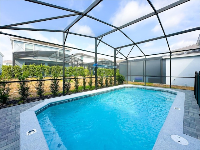 pool with a patio and a lanai