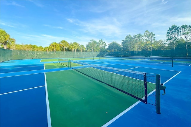 view of sport court featuring fence