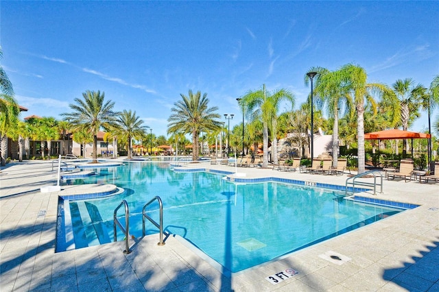 community pool with a patio