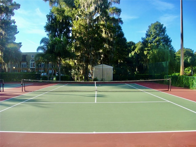 view of sport court with basketball hoop