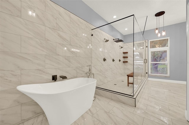 bathroom featuring tile walls and separate shower and tub