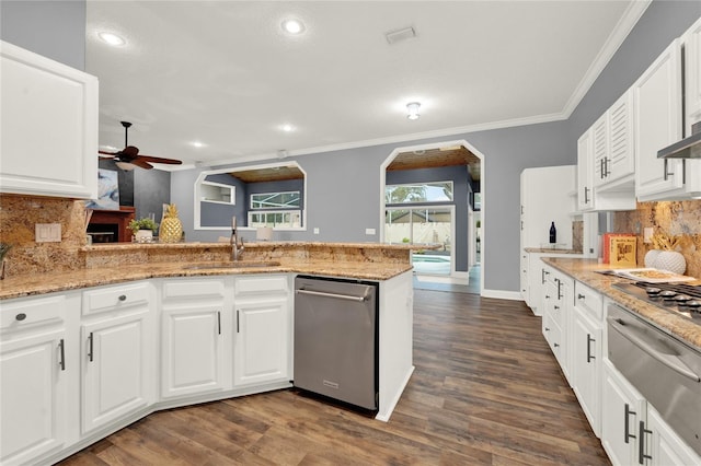 kitchen with sink, crown molding, kitchen peninsula, dishwasher, and white cabinets