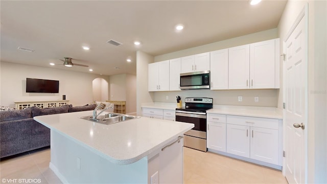 108 Castile Ct, Punta Gorda, FL 33983 - kitchen featuring stainless steel appliances, open floor plan, white cabinetry, light tile patterned floors, and recessed lighting