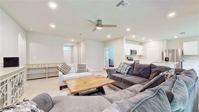 living room with sink and ceiling fan