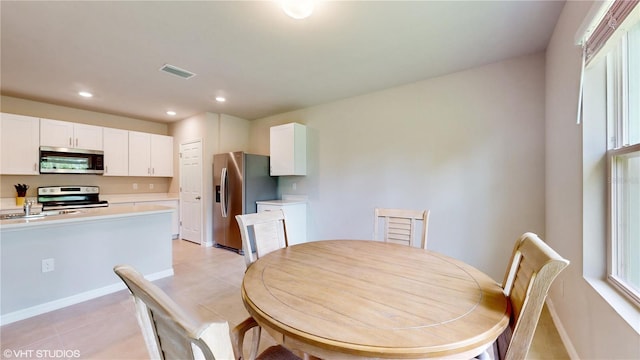 tiled dining area with sink