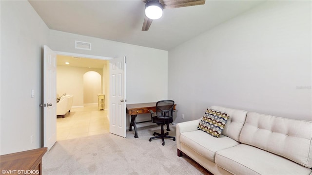 office featuring ceiling fan and light colored carpet