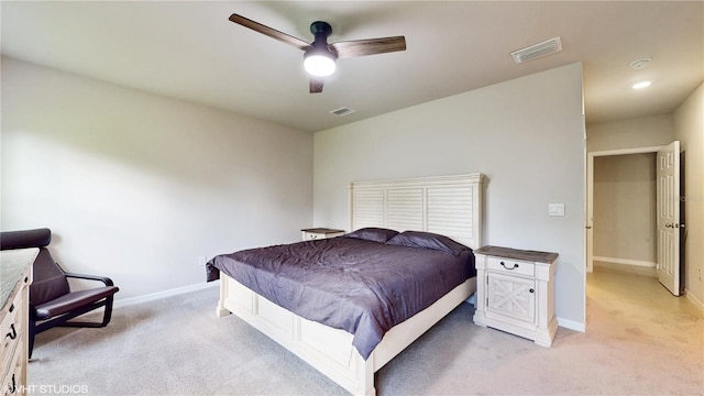 bedroom featuring ceiling fan and light carpet