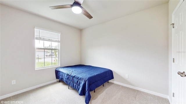 108 Castile Ct, Punta Gorda, FL 33983 - carpeted bedroom with baseboards and a ceiling fan