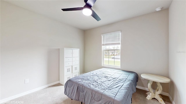 bedroom with ceiling fan and light carpet