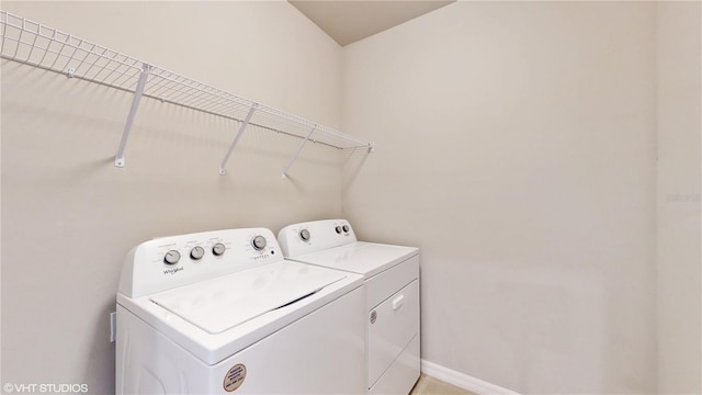 laundry room with independent washer and dryer