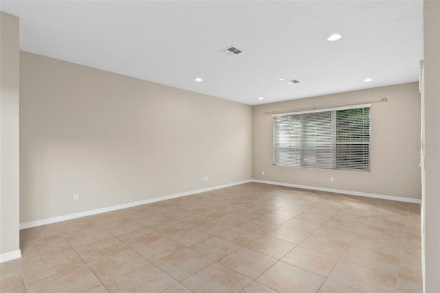 spare room with recessed lighting, visible vents, baseboards, and light tile patterned floors