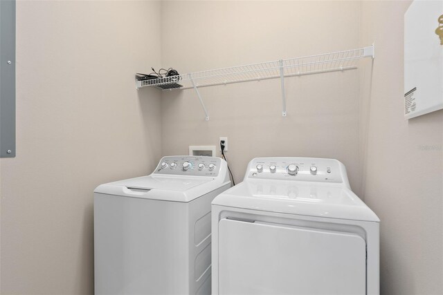 washroom featuring laundry area and washer and clothes dryer