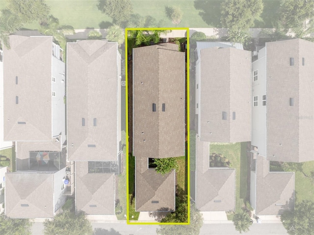 birds eye view of property with a residential view