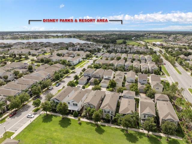 bird's eye view with a water view and a residential view