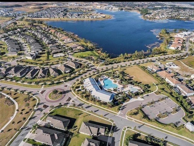 birds eye view of property featuring a water view and a residential view