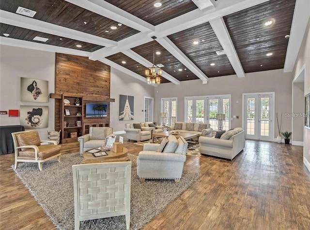 living area with high vaulted ceiling, french doors, wood finished floors, and wood ceiling