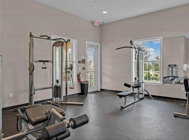 exercise room featuring recessed lighting and baseboards