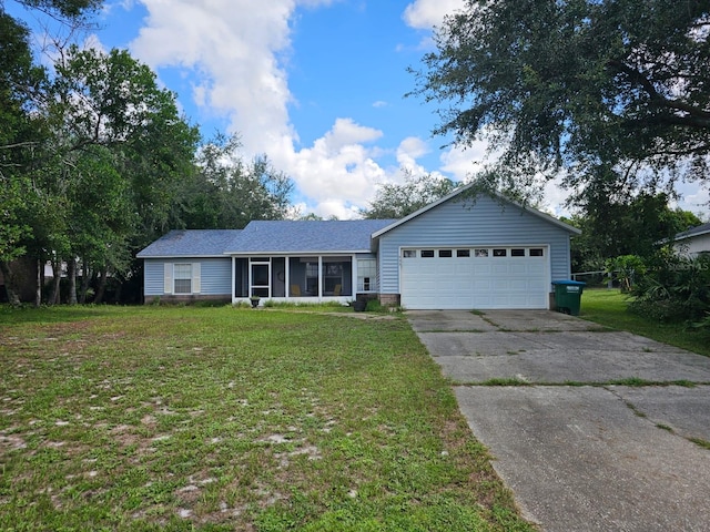 single story home featuring a garage and a front yard