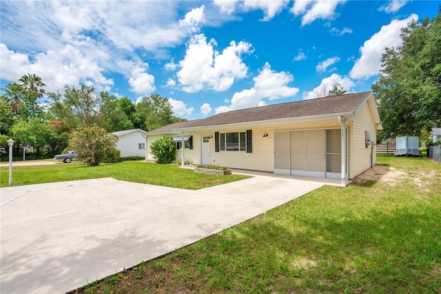 single story home with a garage and a front yard