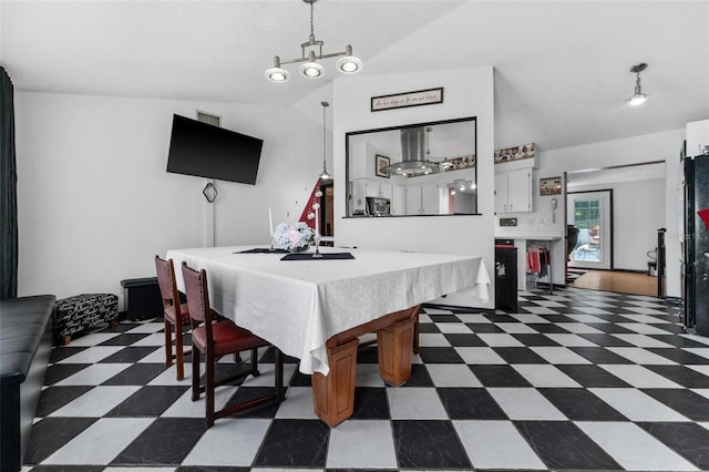 dining space featuring lofted ceiling