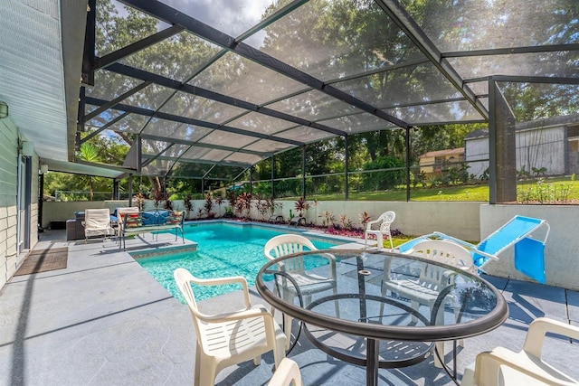 view of pool featuring a lanai and a patio area