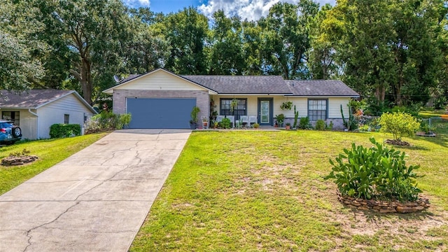 single story home featuring a garage, a front yard, and covered porch