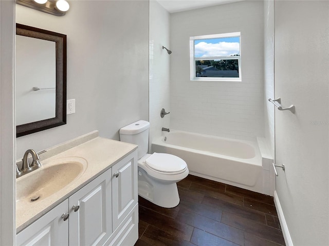 full bathroom with vanity, toilet, and tiled shower / bath combo