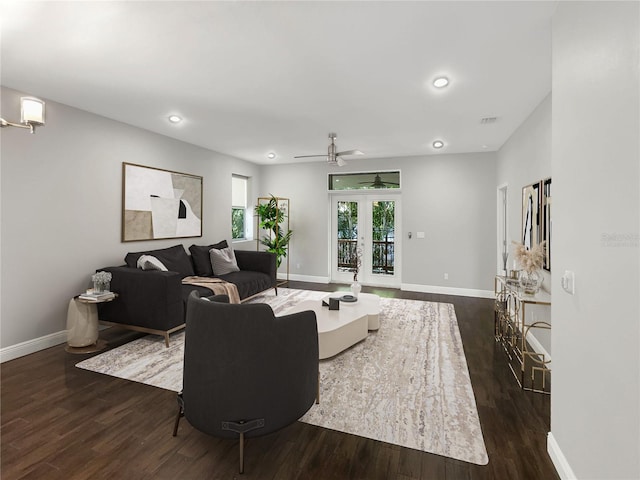 living room featuring dark wood-style floors, recessed lighting, french doors, and baseboards