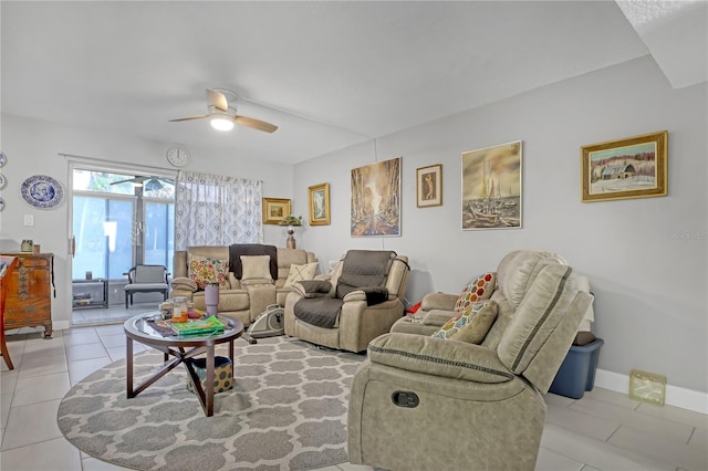 living room featuring light tile patterned flooring and ceiling fan