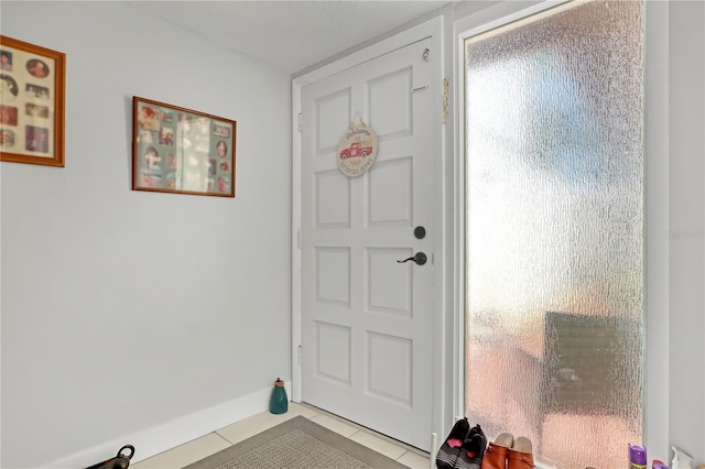 doorway to outside featuring light tile patterned floors