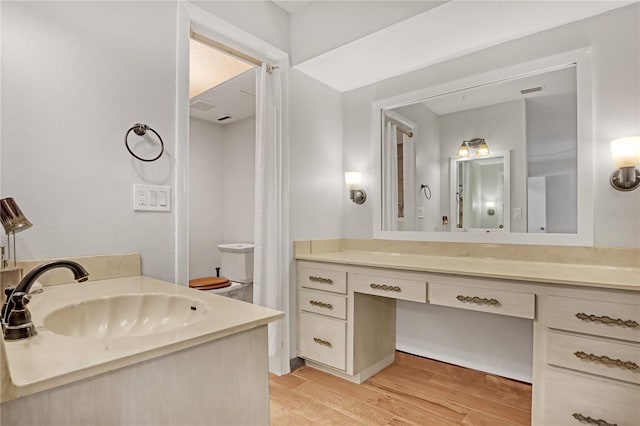 bathroom featuring wood-type flooring and vanity