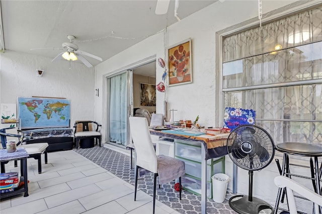 view of patio featuring ceiling fan