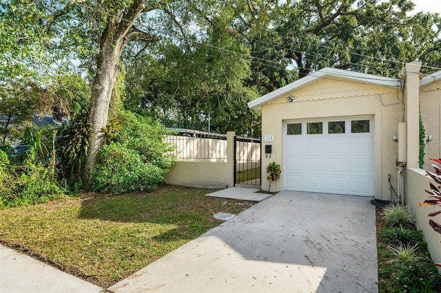 garage featuring a lawn