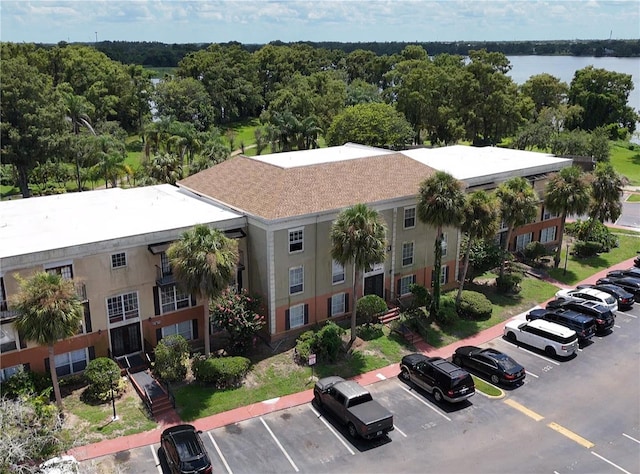 birds eye view of property with a water view