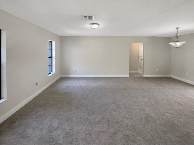 unfurnished room featuring carpet flooring