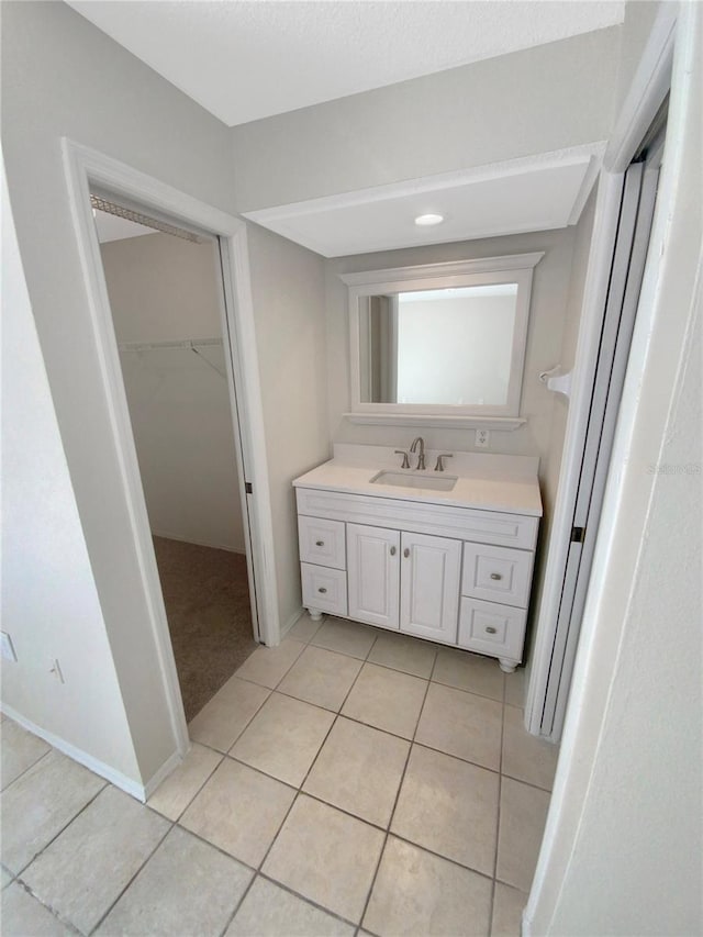 bathroom featuring tile patterned floors and vanity