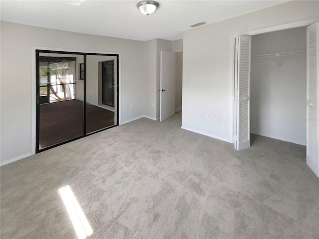 unfurnished bedroom with light carpet