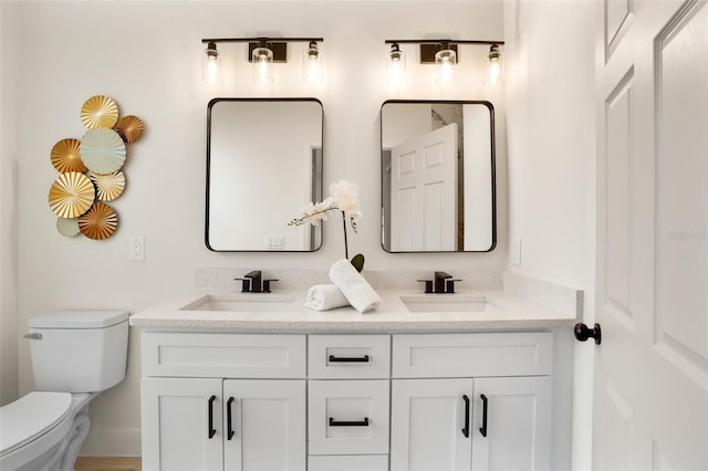 bathroom featuring hardwood / wood-style flooring, vanity, and toilet