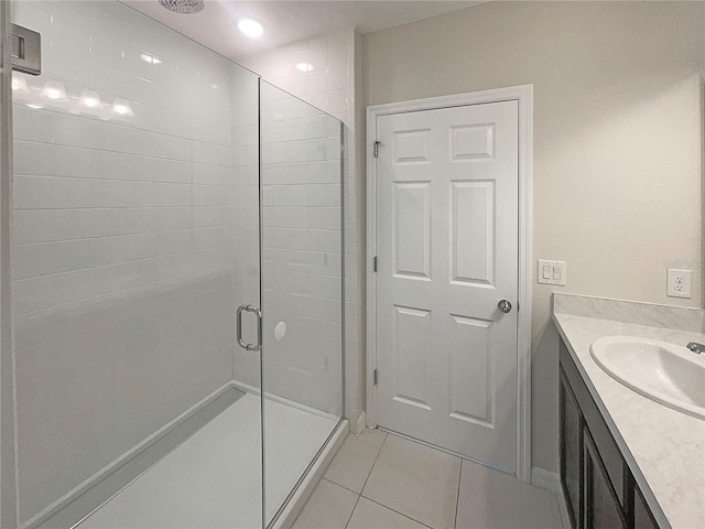 bathroom featuring a shower stall, vanity, and tile patterned floors