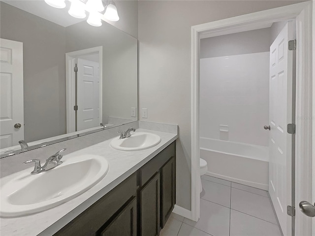 full bathroom featuring tile patterned flooring, a sink, toilet, and double vanity