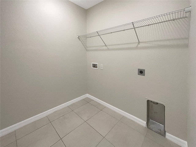 clothes washing area with hookup for a washing machine, laundry area, hookup for an electric dryer, and baseboards