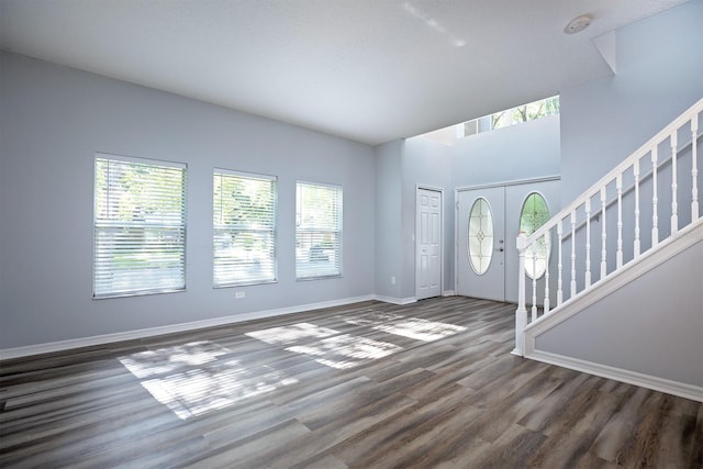 entrance foyer with dark hardwood / wood-style floors