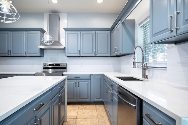 kitchen featuring wall chimney exhaust hood, decorative light fixtures, and decorative backsplash