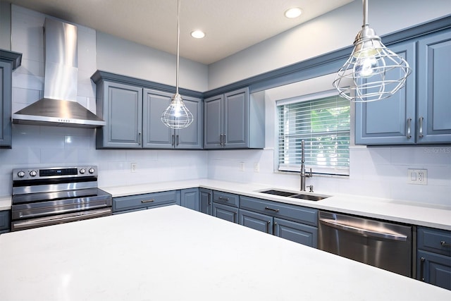 kitchen with tasteful backsplash, decorative light fixtures, stainless steel appliances, and wall chimney range hood