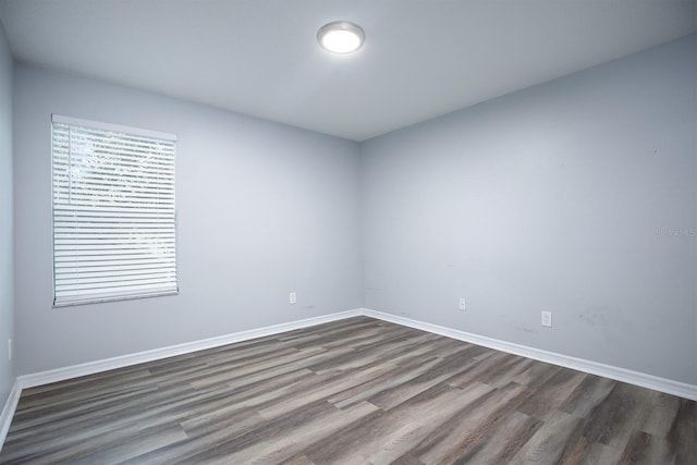 spare room with hardwood / wood-style floors