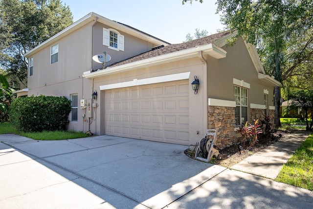 view of side of property with a garage