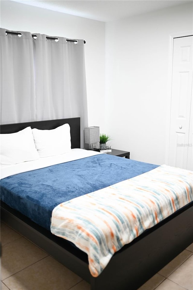 bedroom featuring tile patterned floors