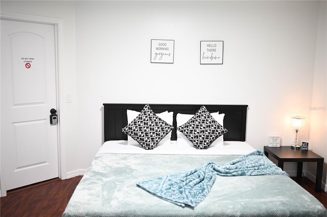 bedroom featuring dark hardwood / wood-style floors