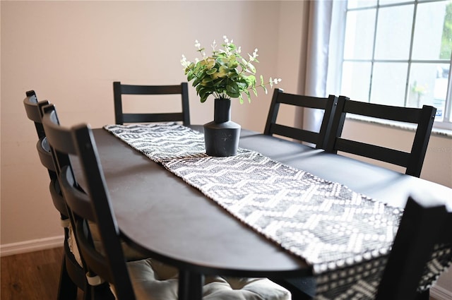 dining space featuring hardwood / wood-style floors